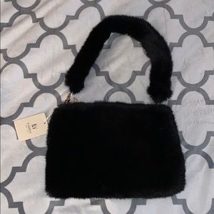 Black furry hand bag